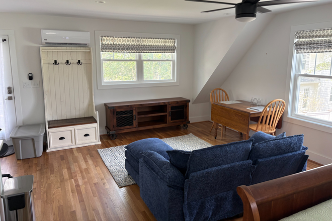 Living room area with dining table/desk - Beautifully Furnished, Quiet Studio Apartment 1 Block from East Campus