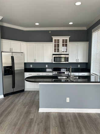 Full Kitchen and Peninsula nook from living room - PRICE REDUCED & SECURE LIVING! Upgraded 2BR/2BA Stetson Square Condo | Steps from UC & Med Centers