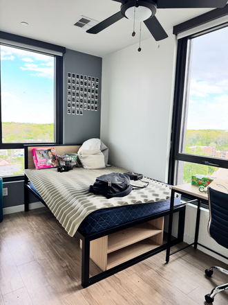 Bedroom with 2 windows - Hub on Campus Apartments