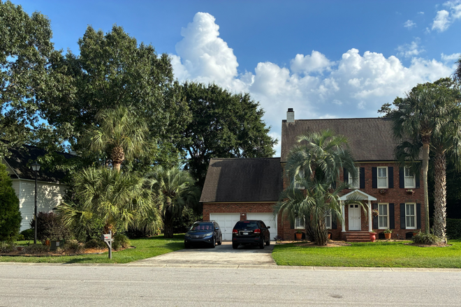 2 story terra cotta brick home, manacured yard with palms. - Quiet home nestled in a peaceful extablished neighborhood.