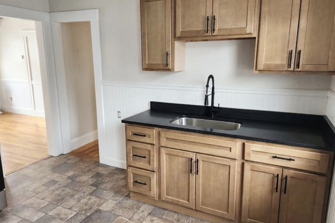 Kitchen with brand new cabinets and counters. - Newly renovated apartment close to Ball Square and I93