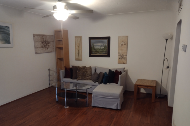 living room showing couch and paintings - 3 Bedroom 2 Bathroom Close to U of Az Campus Duplex