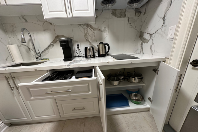 Kitchen - Newly furnished 2-bedroom basement, 6 min to Lawrence Station, private laundry, quiet area. House