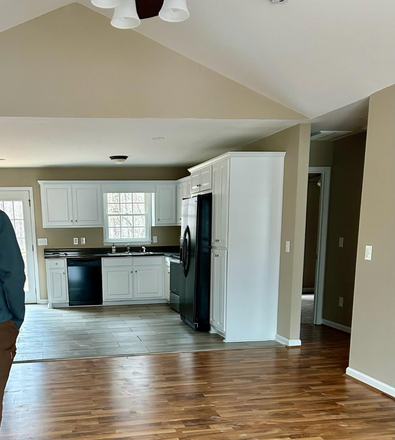 Kitchen with table & chairs, shared by all - One bedroom w/shared bath available as of 7/1/25 (in a 4 bedroom home)