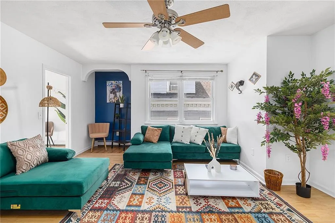 Living room - Furnished 4-Bedroom, 1 Mile from Campus | Private Parking | Water/Sewer Included | $3,200+