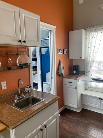 Looking north toward sink, bathroom, cook area - Studio apartment -Furnished. Iris & Folsom Quiet neighborhood. Easy access to shopping