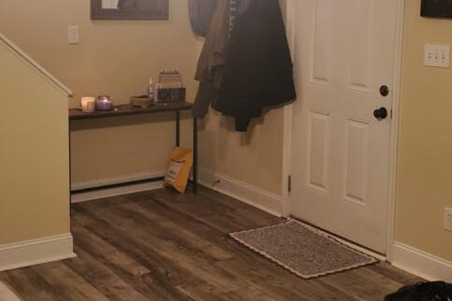 Front door with side table included in rental - Sterling Park Apartments