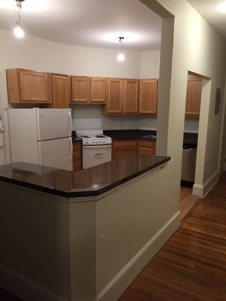 Hub Realty - Prime location, Coolidge Corner, 2 bedroom split, with updated kitchen, breakfast bar and deck