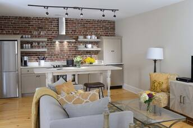 Living Area Looking at Kitchen - Furnished 2 Bedroom 1 Bath Unit Available Apartments