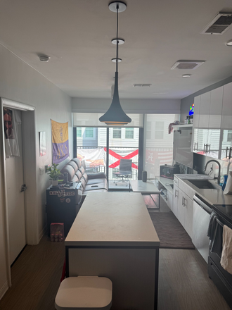 Kitchen/Common area/Balcony - Spring 2027 semester at The Rive ( formerly The Hub)