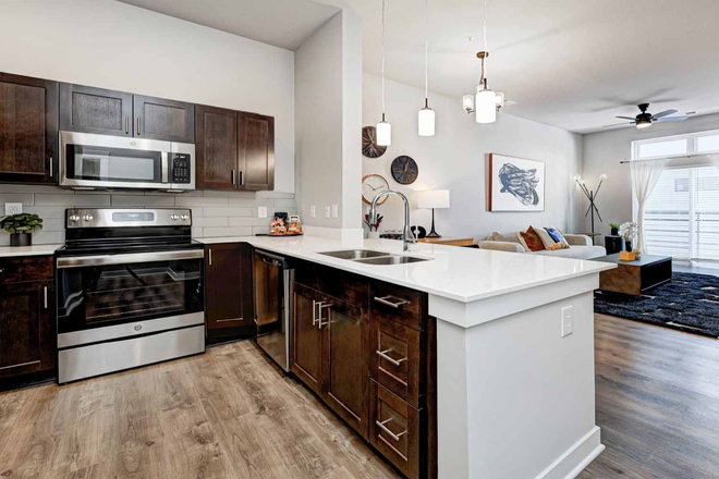 Kitchen and Living Room - Luxury 1B1Ba Apartment at Continuum, very close to campus with included indoor parking