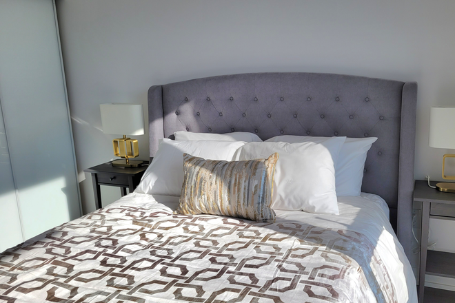 Bedroom - Modern Furnished 1 BD + Den /1.5 BACondo in North York | Free Parking & Fast Wi-Fi