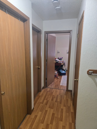 Hallway with view of all 3 bedrooms. The room in the corner is the one available. - Apt. 1Bed in 3Bed/1Bath. Close to Campus. Act Quickly!
