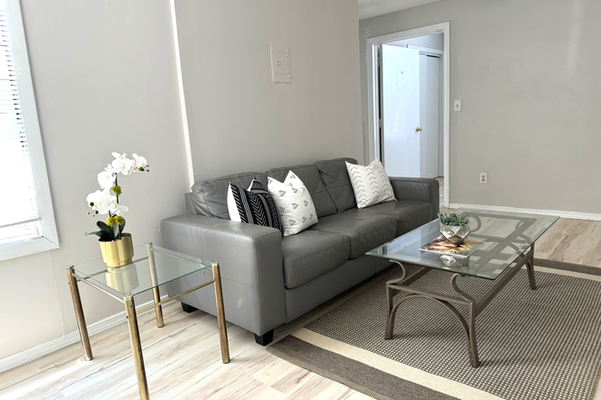 Living Room - Furnished Room with Office and Private Bath. for Female roommate. Utilities Incl.