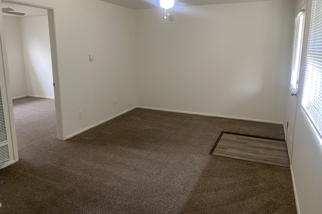 Living Room - 1 bedroom apartment at Timber Ridge Apartment Homes close to campus with free parking!