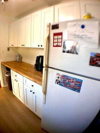 kitchen has new cabinets and butcherblock countertops - Close + Spacious House -- Just Remodeled -- 5 Bedrooms, 2 Baths and more! Available Now