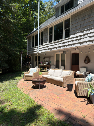 Back patio and back door - Easy walk or bike to campus. Quiet woodland view.