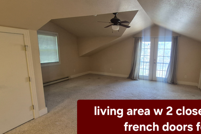 Living area with french doors - Above-garage Studio apartment in Old North End (north downtown) including utilities/cable/interne