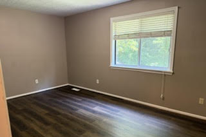 Primary Bedroom - Diamond in the rough! 3 BR two story duplex w attached Garage and Yard Duplex