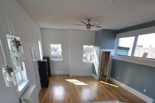 upgraded loft - view from kitchen - Unique PH loft in brick, elevator bldg near Harvard Sq. Upgraded. 2 full baths! Huge deck!