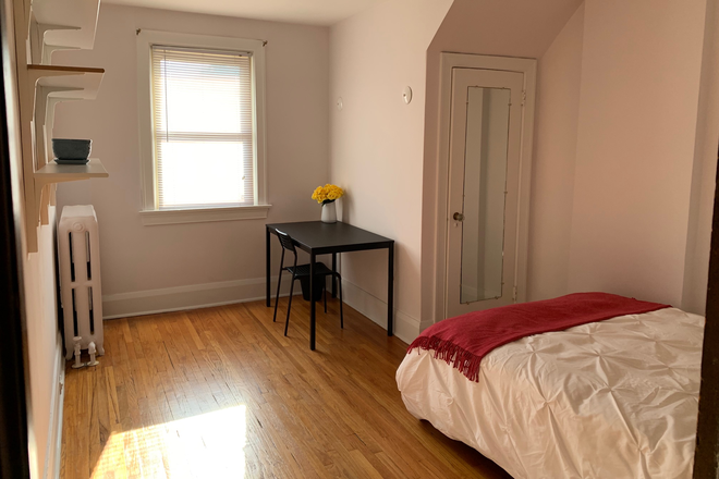 Bedroom 1 - Top floor 2 BR apt - sunny, spacious, partially furnished, steps to TTC, private laundry!
