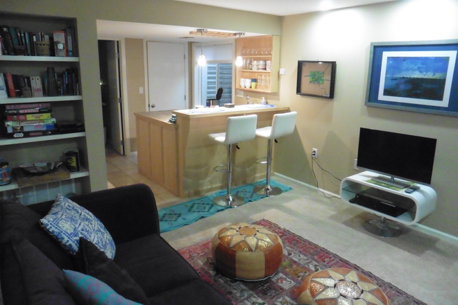 living room - 700 sq feet basement with windows w/ private bath, bedroom, kitchenette & garage