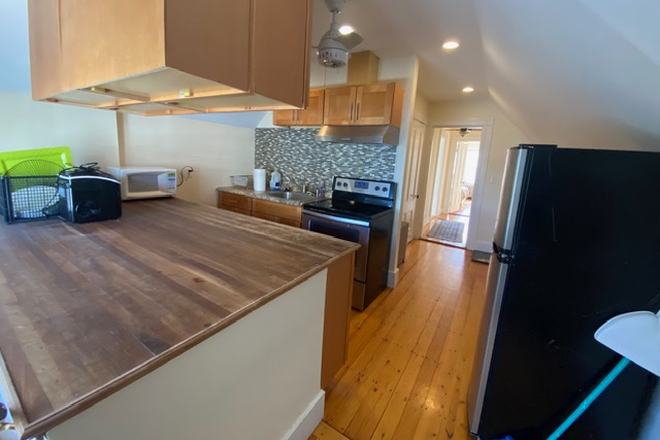 Kitchen - Furnished 1-Bedroom with Office Nook & Living Room – JP Apartments