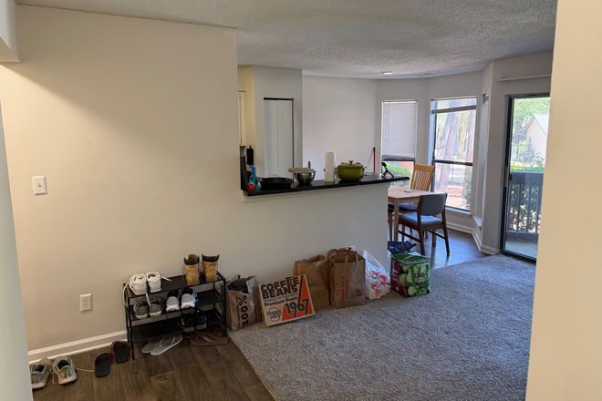 Living room facing dining table - Poplar Place Apartments, PhD student looking for roommates for nice 2b2b!