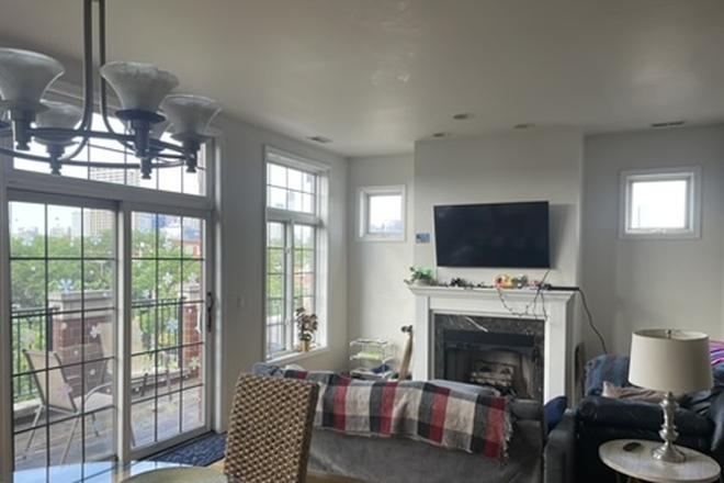 Living Area - Private Room in Furnished 3BR near UIC | Balcony w/ Skyline View + Free Parking