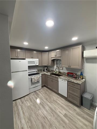 Kitchen new counters with Range microwave, fridge, dishwasher, - Charming/Remodeled Uptown Condo Located right off St Charles. Ave. and walking distance to Audubon P