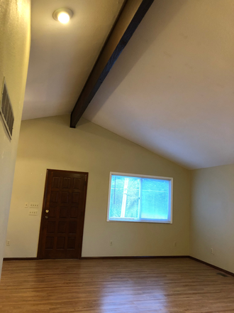 Main living area features vaulted ceiling. - Large 2 bedroom 1 bath apartment with lots of storage in great location!