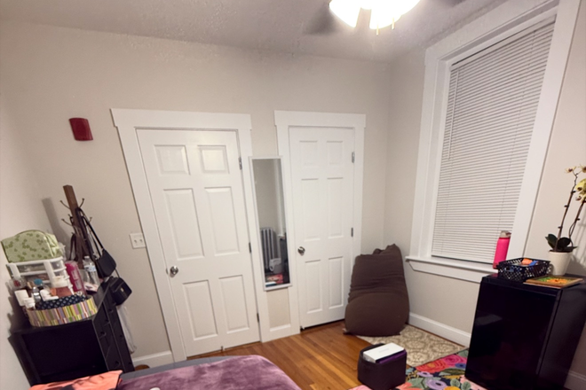 Bedroom: closet door to the right, and AC not pictured, but installed by the window closest to the closet door! - Convenient spot right on campus, across the Northeastern Green-line stop