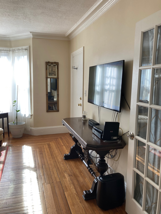 living room - eastside 2 bedroom, freshly painted, central air, 2 car parking in back