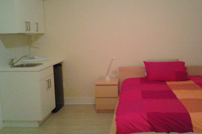 Bedroom - Comfortable studio close to public transportation, shopping, restaurants and parks House