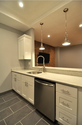 Sink, dishwasher, and breakfast bar - Summer 1 sublet Apartments