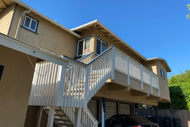 Exterior. Building, stairs, front-side balcony, garage doors, driveway. - Old Towne Orange Apartment near Plaza Park/The Orange Circle. Close to Chapman University.
