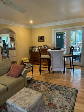 Front family room (with access to screening in porch). - Quiet home nestled in a peaceful extablished neighborhood.