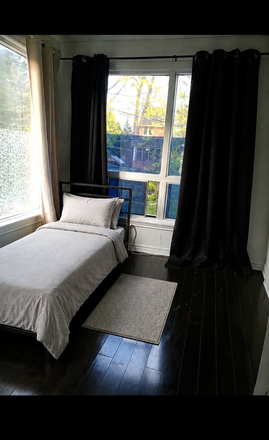 Bedroom, lots of natural light, lock on door for privacy. - Furnished Bedroom w/ WIFI. 5 min to Bloor Line Subway (Keele) only 15 Minutes to St George Stn.