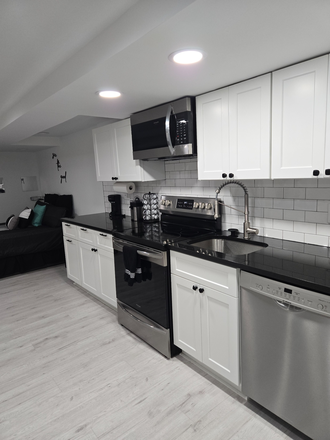 Full kitchen with microwave and dishwasher - Fully furnished newly remodeled studio apartment 7 minutes from campus