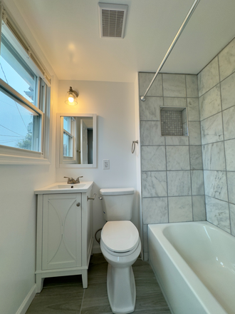 Marble bathroom tiles. 2-year old vanity and bathroom set up. - Completely Renovated Central Air Property Right Next to Hopkins Townhome
