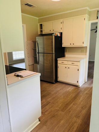 From the laundry; door to backyard is on right - 4BR/2Ba in Great Neighborhood, Convenient to Everything! House