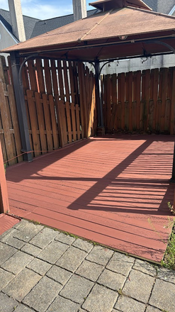 Spacious outdoor deck with wooden pergola, perfect for relaxing and entertaining - 3 Bedroom + Bonus room with fenced yard close to campus