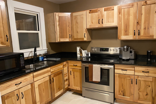 Kitchen with Hickory cabinets from Dining area - Furnished Hialeah Cottage, 3.3 miles from Campus