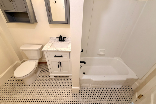 Bathroom with tub and shower - Grand Block- Available 7/1/26- Center of Amherst Apartments