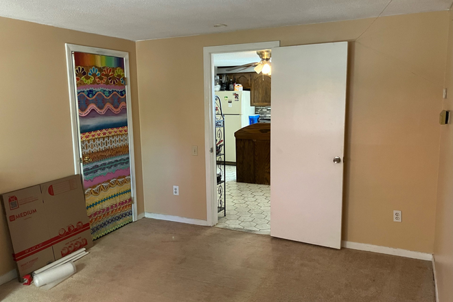 One of the rooms, off of the kitchen. Has a closet. - 113 W. Meadow rd Townhome