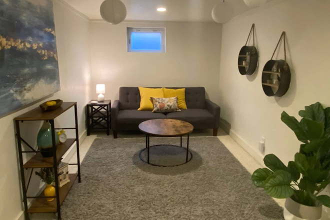 Your own spacious living room - Basement apartment in house: Private bedroom, bathroom, living room, kitchenette