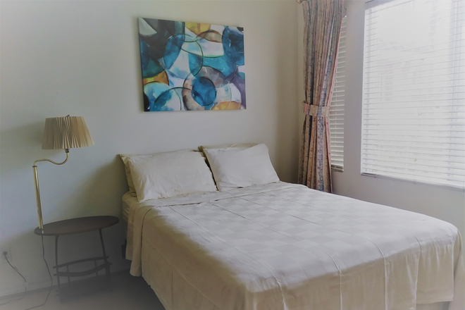 One bedroom furished with a a queen bed - Furnished Private Studio in Irvine – Near Culver Ranch 99 House