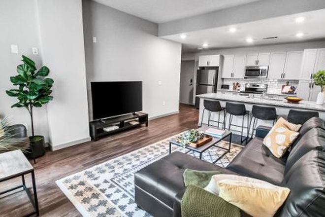 Living room/ barstool counter - Junction 49 Apartments