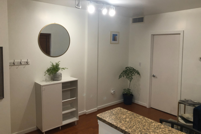Shoe storage. - 1BR Corner Unit in Columbia Heights, Private Parking Included (15 min walk to Howard) Condo