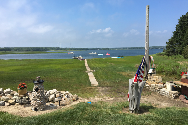 Waterfront access in front yard - Waterfront Home. Fully Furnished. All Utilities Included. Direct Ocean Access & Beautiful Sunsets.